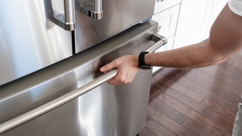 Close-up of unrecognizable man opening freezer door