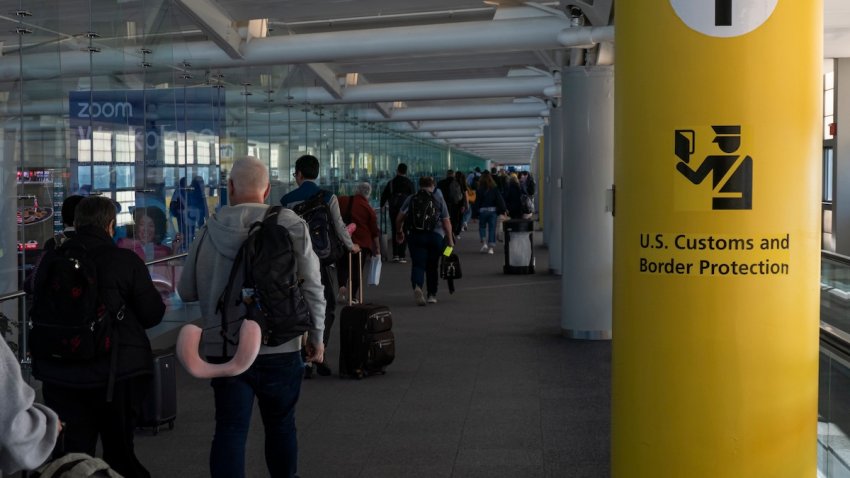 U.S. Customs and Border Protection CBP sign, inscription and symbol in yellow background in Newark Liberty International Airport EWR serving the New York Metropolitan area with arriving passenger walking in the terminal towards the immigration passport control. United States Customs and Border Protection is the largest federal law enforcement agency of the United States Department of Homeland Security with agents and officers, it’s the primary border control organization. Newark, United States of America on November 2024 (Photo by Nicolas Economou/NurPhoto via Getty Images)