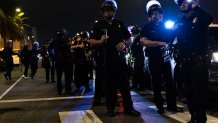 Los Angeles, CA - June 06: Law enforcement officers work to clear protesters in downtown on Friday, June 6, 2025 in Los Angeles, CA. (Luke Johnson / Los Angeles Times via Getty Images)