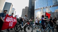 Anti-ICE protesters holding banners are pictured on State Street in downtown Chicago, the United States, June 10, 2025. Demonstrations against the Trump administration’s immigration crackdown have intensified and spread far beyond Los Angeles, with thousands of people gathering in at least two dozen cities by Tuesday night, U.S. media reported.   TO GO WITH “Roundup: Protests expand beyond LA to dozens of U.S. cities” (Photo by Vincent D. Johnson/Xinhua via Getty Images)
