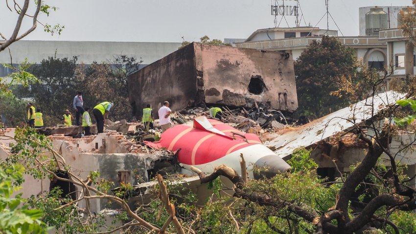 An investigation team inspects the wreckage of Air India flight 171 a day after it crashed in a residential area near the airport, in Ahmedabad on June 13, 2025. Investigators recovered a black box recorder from the crash site on June 13 of a London-bound passenger jet that ploughed into a residential area of India’s Ahmedabad city, killing at least 265 people on board and on the ground.