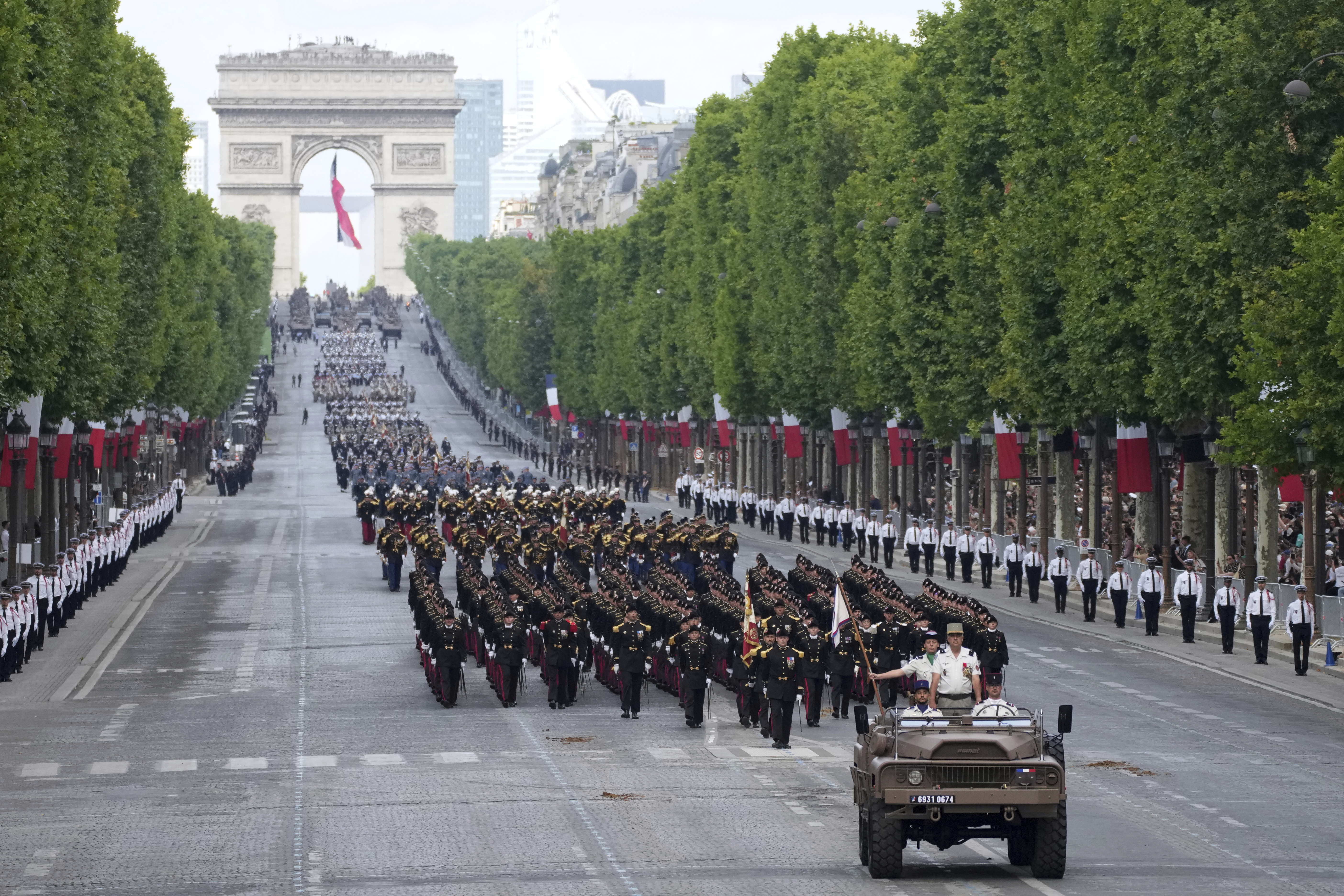 French troops march on the Champs-Elysees avenue during the Bastille Day parade, Monday, July 14, 2025 in Paris.