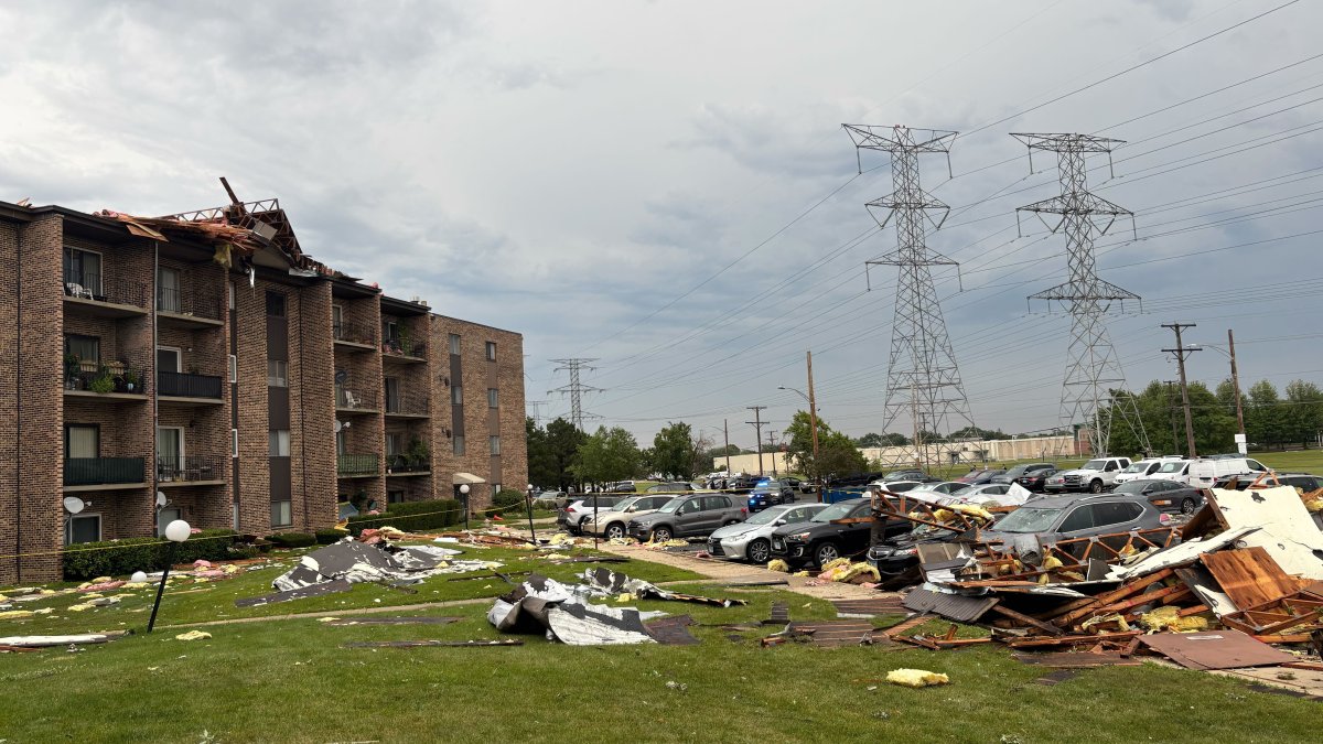 Roof of suburban apartment building torn off by severe storms, dozens evacuated