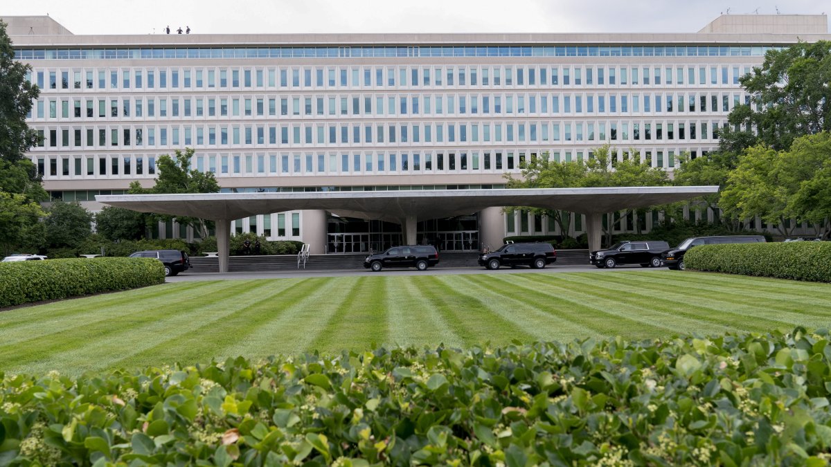Why Are Construction Workers Climbing Fences at CIA Headquarters During an ICE Raid?
