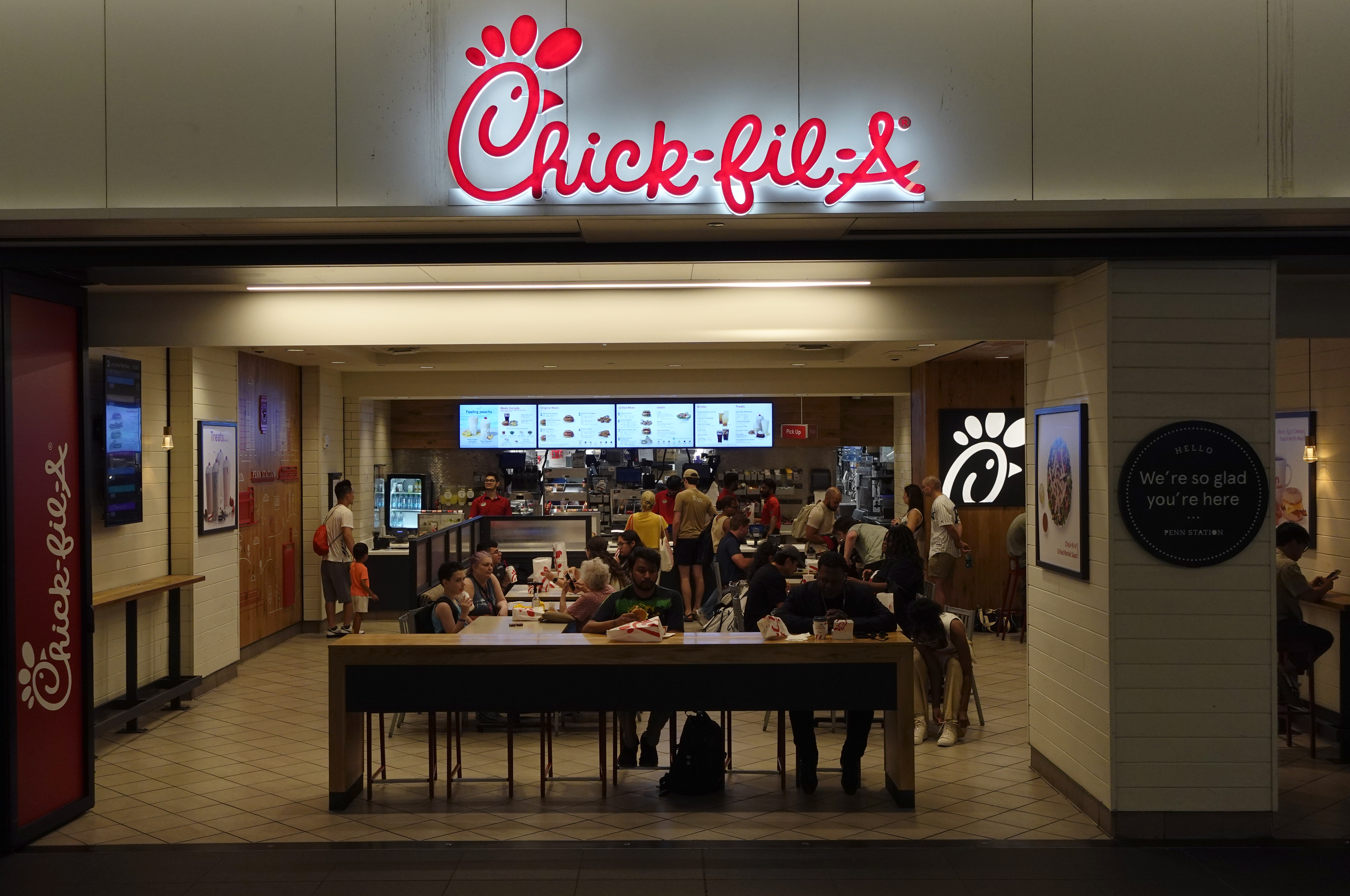 People eat at a Chick-fil-A restaurant in New York City.