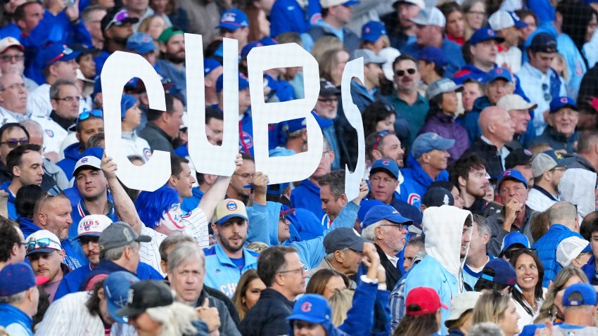 CHICAGO, IL – OCTOBER 08: Chicago Cubs fans hold a sign during Game Three of the National League Division Series presented by Booking.com between the Milwaukee Brewers and the Chicago Cubs at Wrigley Field on Wednesday, October 8, 2025 in Chicago, Illinois. (Photo by Mary DeCicco/MLB Photos via Getty Images)