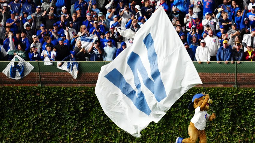 CHICAGO, IL – OCTOBER 08:  Chicago Cubs mascot Clark celebrates after the Cubs defeated the Milwaukee Brewers in Game Three of the National League Division Series presented by Booking.com at Wrigley Field on Wednesday, October 8, 2025 in Chicago, Illinois. (Photo by Mary DeCicco/MLB Photos via Getty Images)