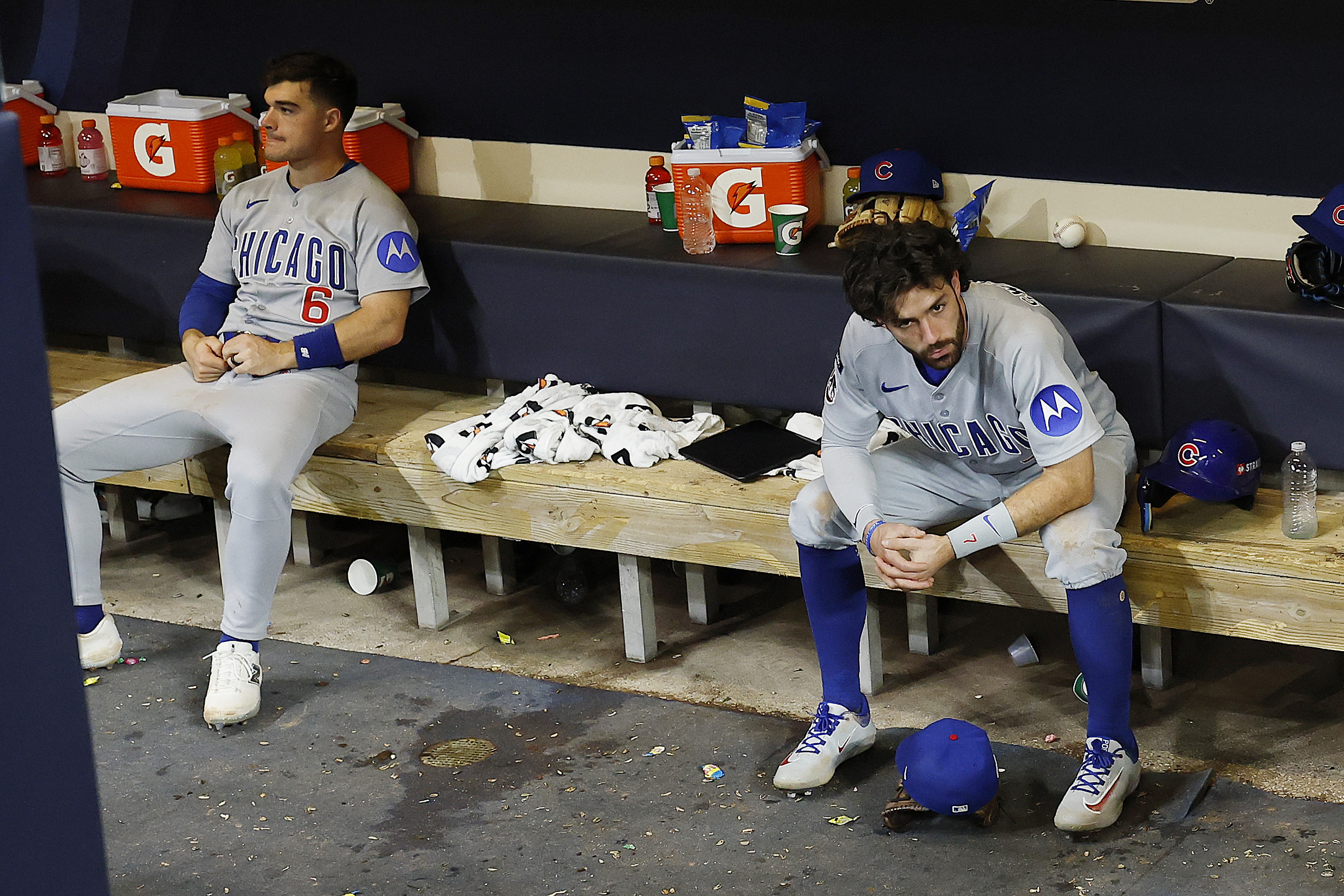 MILWAUKEE, WISCONSIN – OCTOBER 11: Matt Shaw #6 and Dansby Swanson #7 of the Chicago Cubs react after losing to the Milwaukee Brewers in game five of the National League Division Series at American Family Field on October 11, 2025 in Milwaukee, Wisconsin. (Photo by John Fisher/Getty Images)