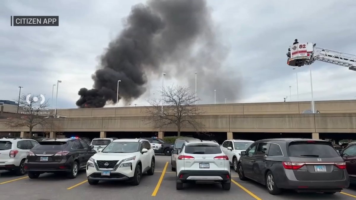 Large plume of smoke billows from fire in parking structure at Woodfield Mall