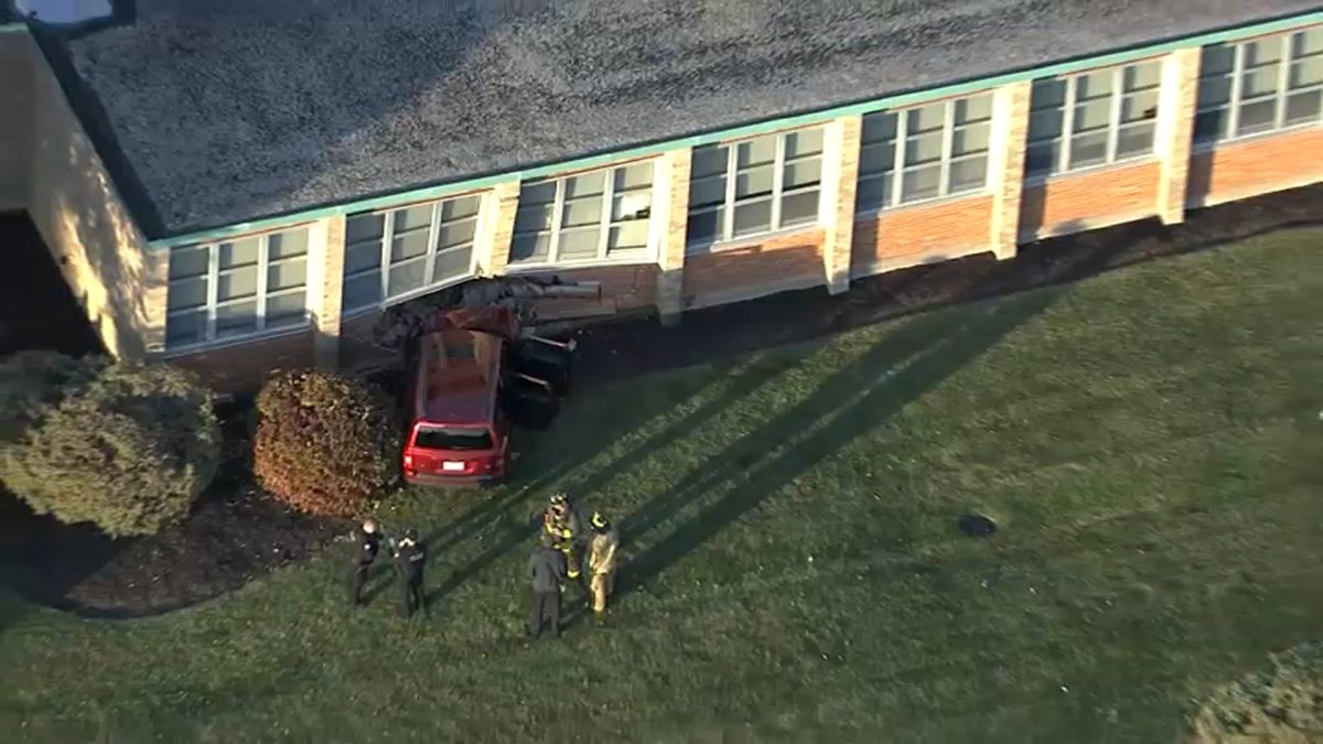 See the scene after a car crashed into suburban high school outside Chicago