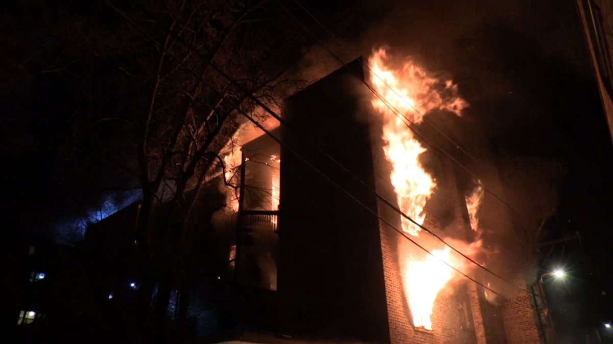 2 injured, including firefighter, after North Side apartment building goes up in flames