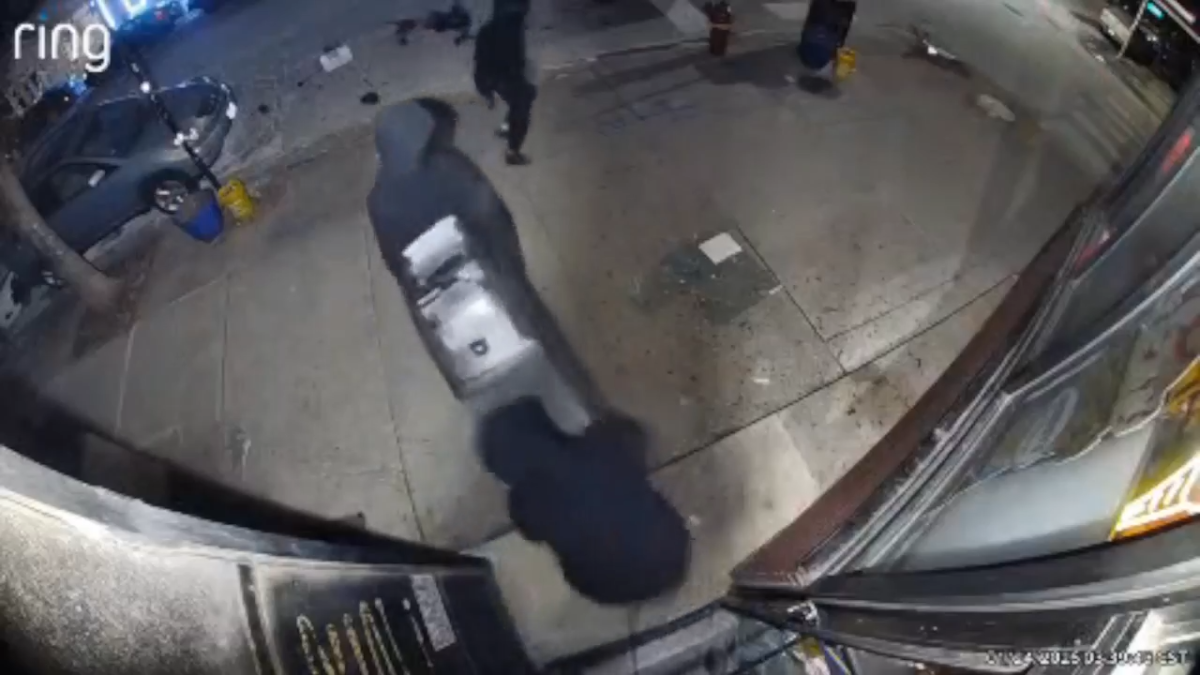 &lsquo;It was bolted to the floor: Video shows masked burglars stealing ATM machine from West Town store