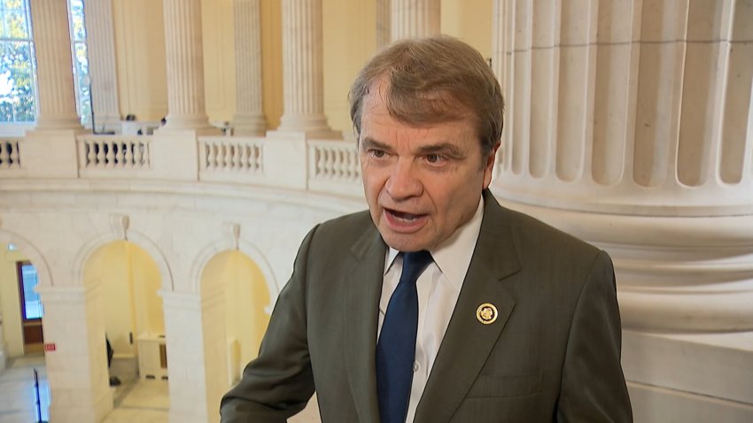 Rep. Mike Quigley is interviewed on a balcony in the Capitol rotunda.