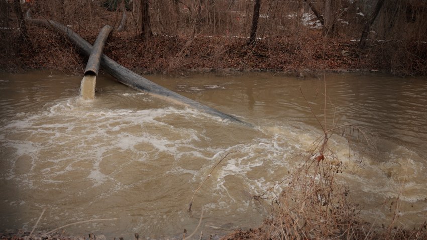 CABIN JOHN, MARYLAND – FEBRUARY 16: Pumps and pipes divert raw sewage into the C&O Canal and around a broken section of the Potomac Interceptor, a six-foot-wide pipe that collapsed on January 19, in between the Clara Barton Parkway and the canal on February 16, 2026 in Cabin John, Maryland. More than 300 million gallons of raw sewage poured into the Potomac River after the underground pipeline collapsed on January 19. According to the Potomac Riverkeeper Network and researchers at the University of Maryland, fecal-related bacteria and disease-causing pathogens in the Potomac River reached levels more than 2,700 times the safe limit.  (Photo by Chip Somodevilla/Getty Images)
