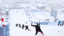 Workers clear snow