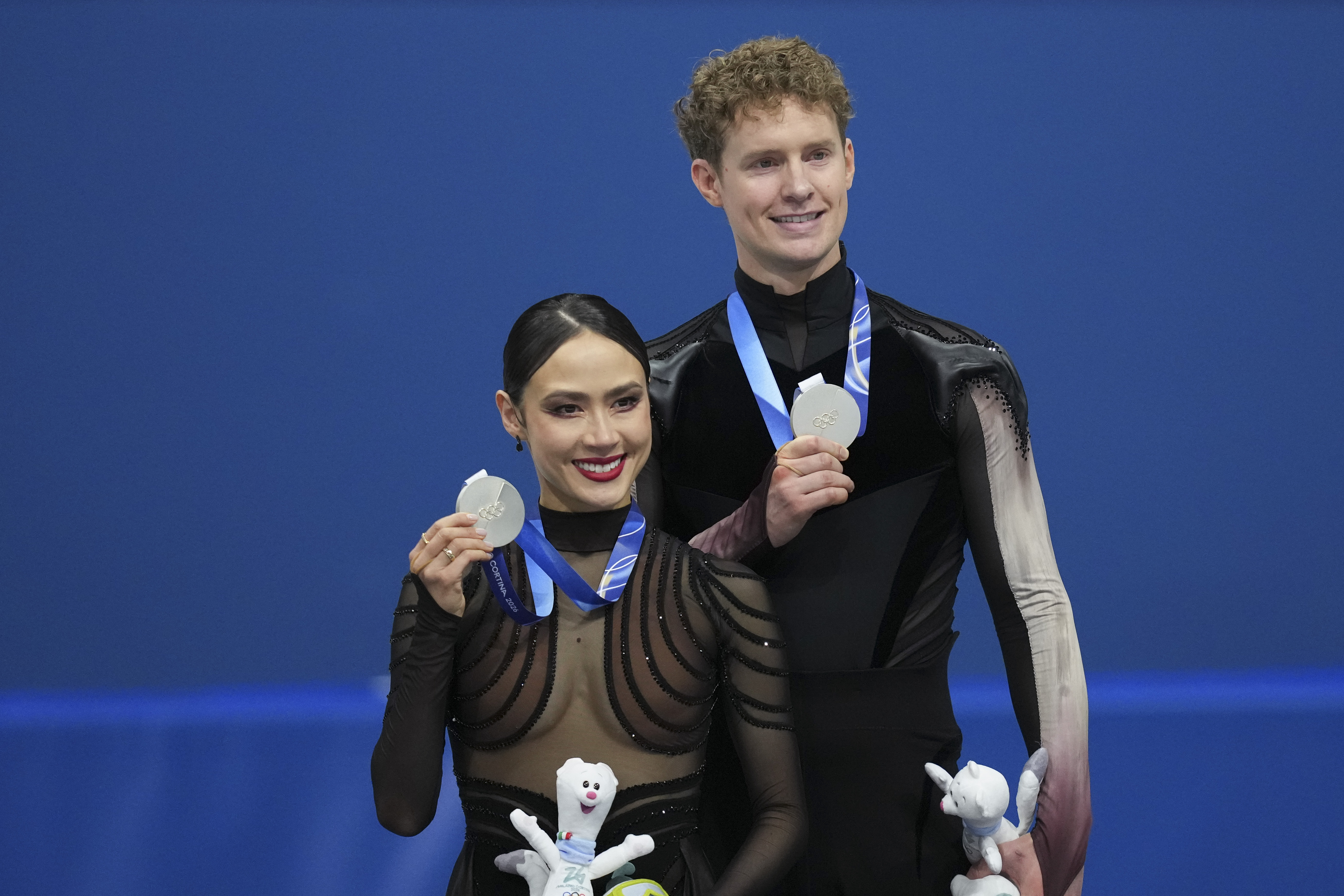 Figure skating's first individual event at the Winter Olympics ended with a shocking medal upset, and a questionable score from one of the judges.