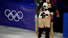 Feb 21, 2026; Milan, Italy; Mikhail Shaidorov of Kazakhstan greets Jackie Chan after performing in the figure skating exhibition gala during the Milano Cortina 2026 Olympic Winter Games at Milano Ice Skating Arena. Mandatory Credit: Amber Searls-Imagn Images