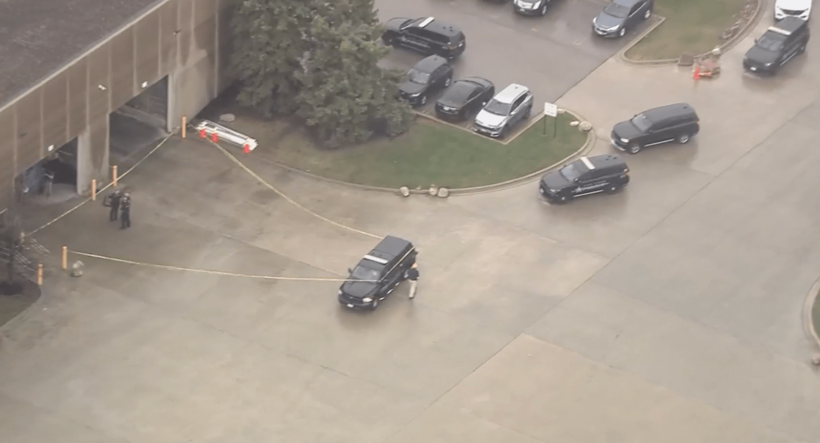 Person dies after becoming trapped underneath crane at suburban business