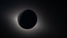 In this image provided by NASA, The Artemis II crew captured from lunar orbit, the Moon eclipses the Sun on Monday, April 6, 2026.  (NASA via AP)