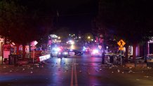 BLOOMINGTON, INDIANA - APRIL 26: Police officers investigate the scene following a shooting on Kirkwood Avenue on April 26, 2026, in Bloomington, Indiana. According to reports, at least nine people were injured in a shooting along Kirkwood Avenue early Sunday morning. (Photo by Jeremy Hogan/Getty Images)