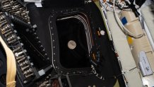 Before going to sleep on day five of the mission, the Artemis II crew snapped a photo of the moon as it drew close in the window of the Orion spacecraft.