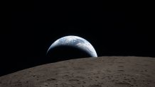 Earthset captured through the Orion spacecraft window at 6:41 p.m. EDT, April 6, 2026, during the Artemis II crew’s flyby of the Moon. 