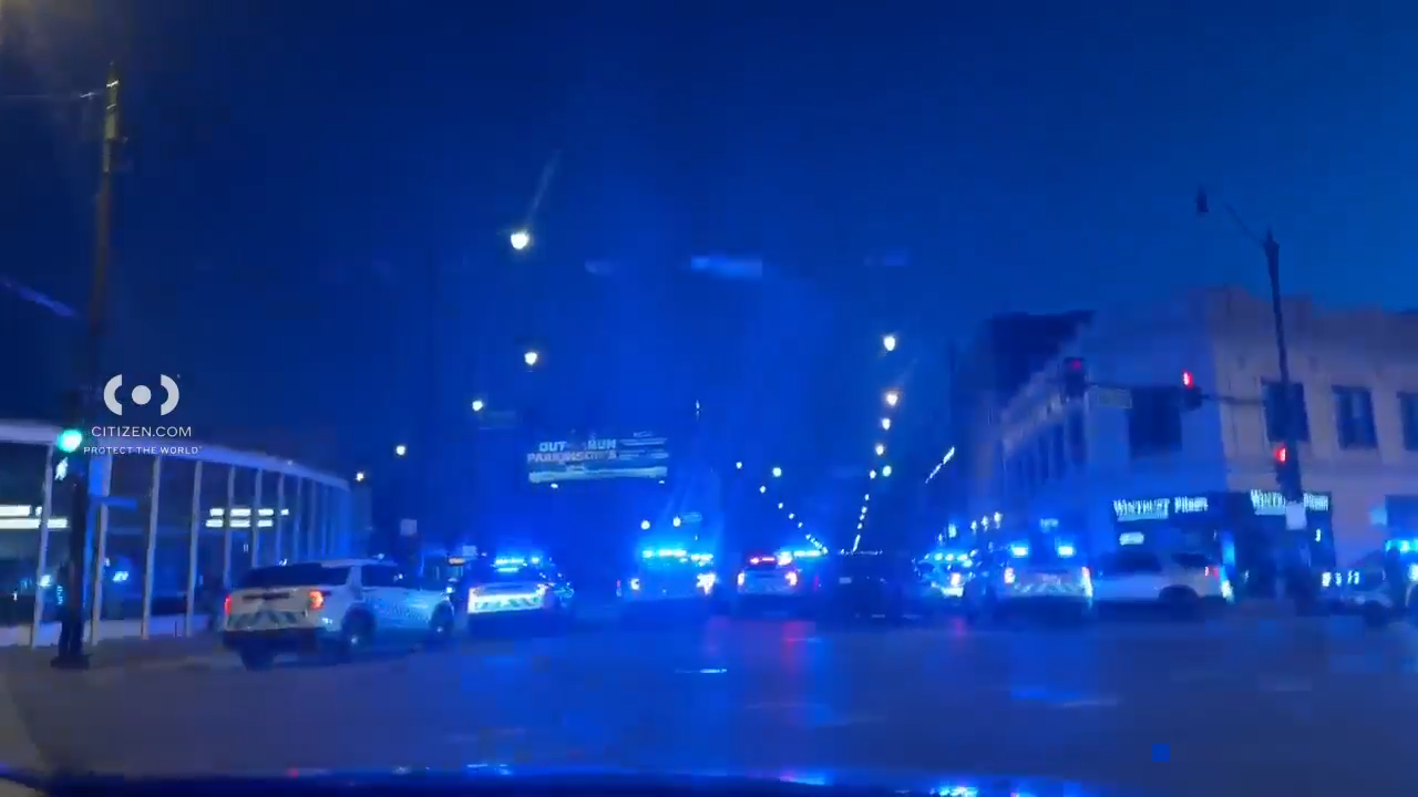 Large police response blocks traffic outside the Chicago Public Library in Pilsen