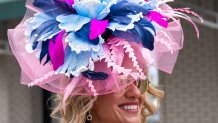 A woman attends the 152nd running of the Kentucky Derby at Churchill Downs in Louisville, Kentucky, on May 2, 2026. (Photo by Leandro Lozada / AFP via Getty Images)