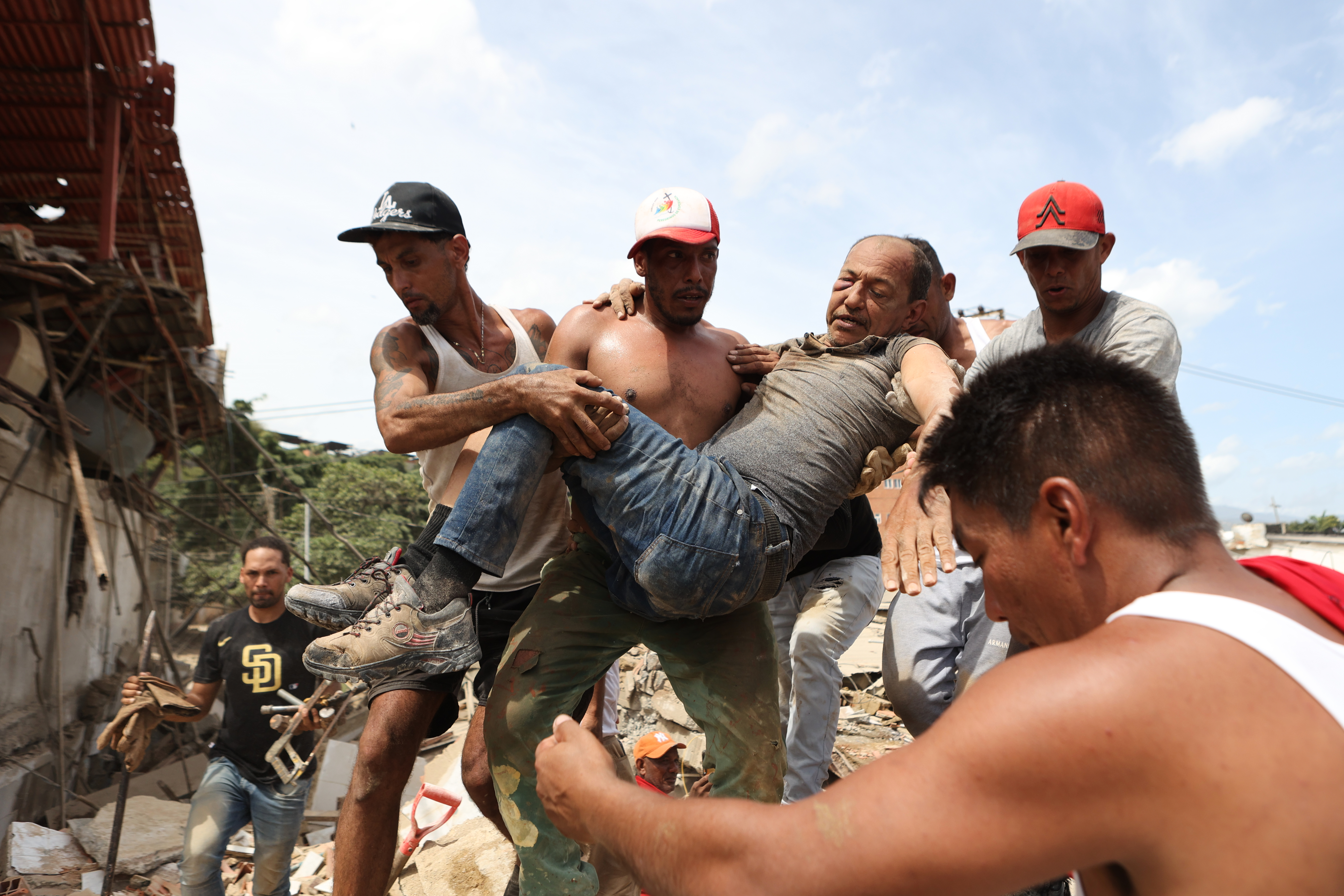 Rescuers race to find survivors trapped in rubble after deadly Venezuela earthquakes