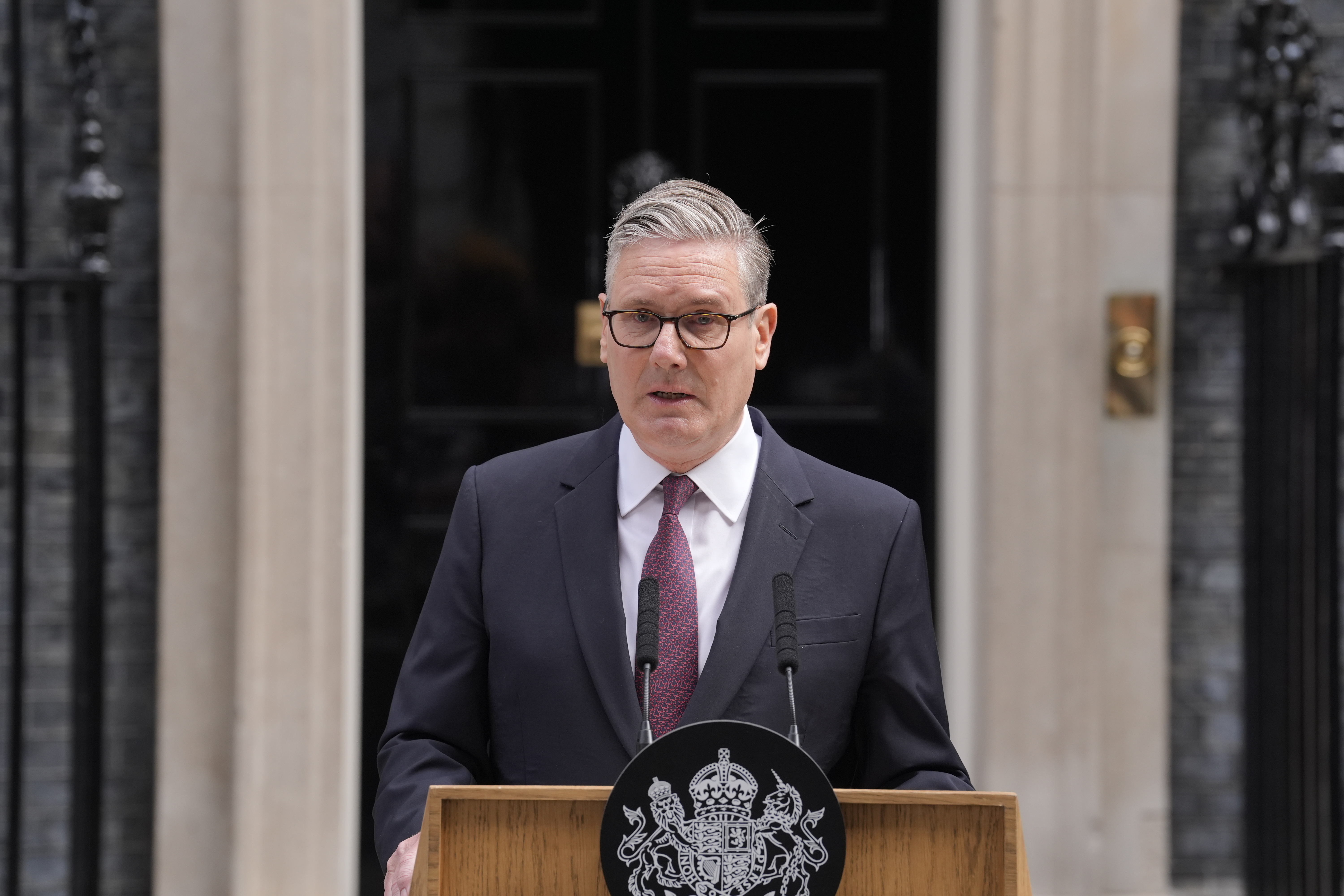 British prime minister resigns but will stay on until successor is chosen