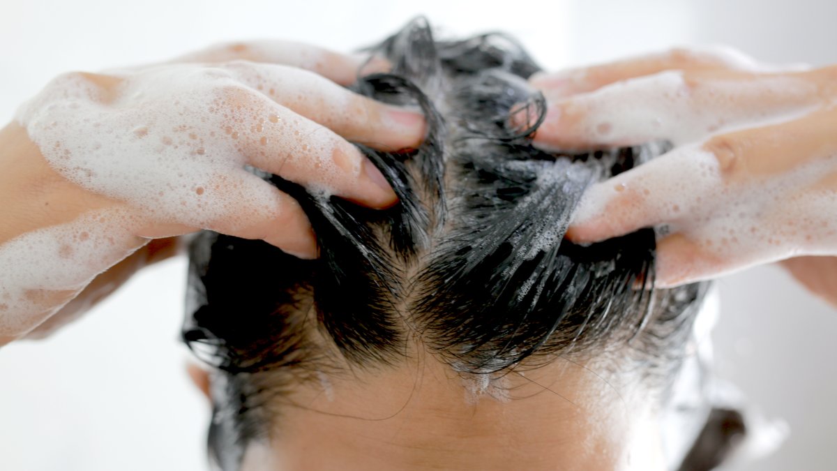 Shampoo bottles in a bathroom setting during a bacterial contamination recall