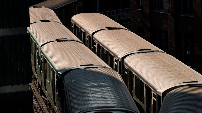 CTA trains on a platform in Chicago.