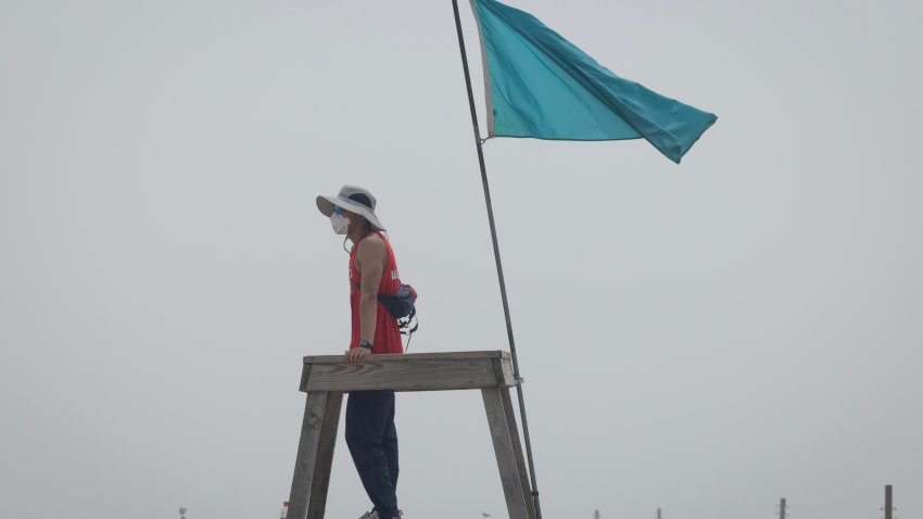 CHICAGO, ILLINOIS – JULY 16: A lifeguard on North Avenue Beach wears a mask to protect himself as smoke from Canadian wildfires blankets the city on July 16, 2026 in Chicago, Illinois. City officials have encouraged people to stay inside as the air quality index today in the city has been rated “very unhealthy”, with some nearby suburban areas rated “hazardous”.  (Photo by Scott Olson/Getty Images)