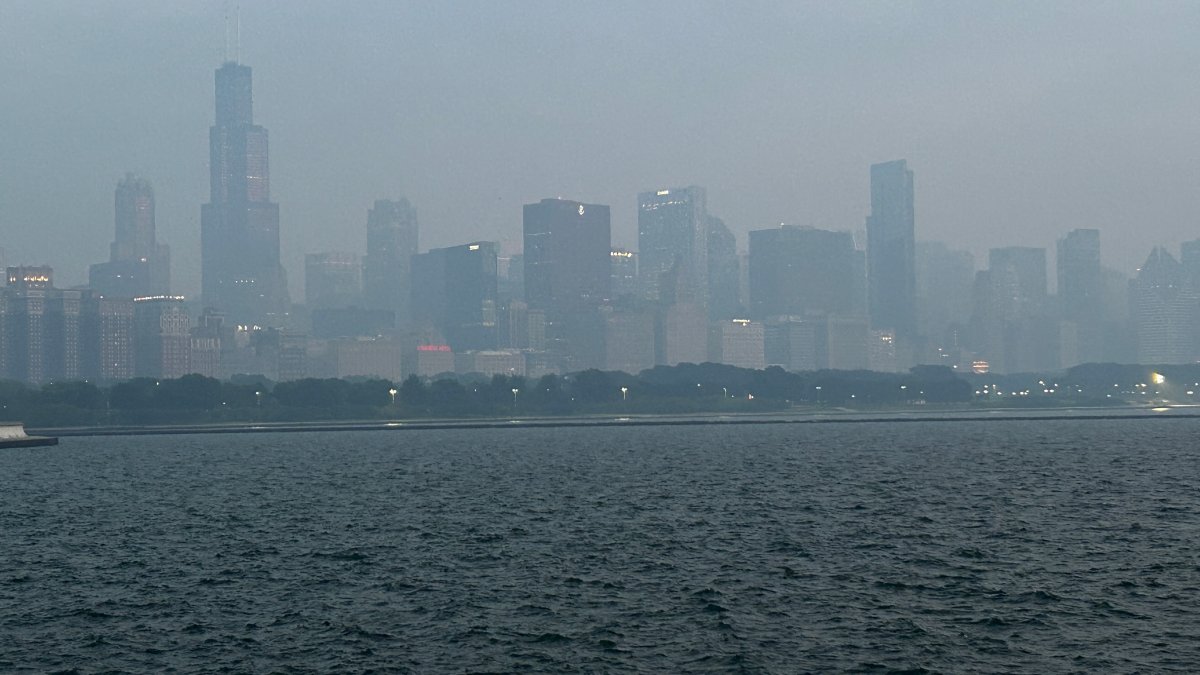 Smoke from wildfires blanket Chicago area, with skyline disappearing under hazy skies