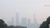 Smoke from wildfires blankets Chicago area, with skyline disappearing under hazy skies