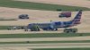 Emergency vehicles surround American Airlines plane on O'Hare tarmac after tires blown