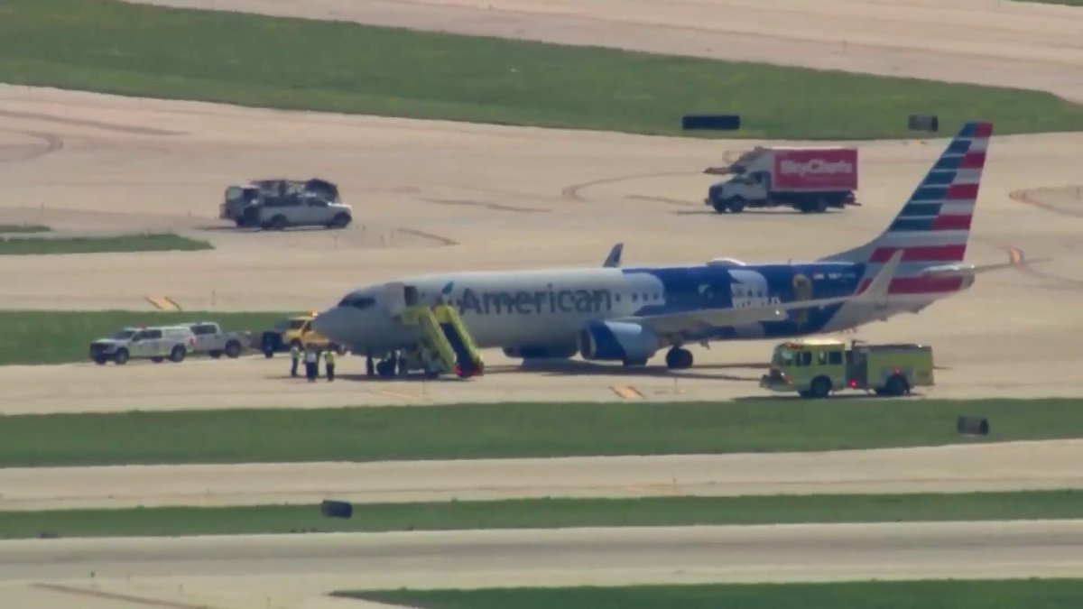 Emergency vehicles surround American Airlines plane on OHare tarmac Emergency vehicles surround American Airlines plane on OHare tarmac