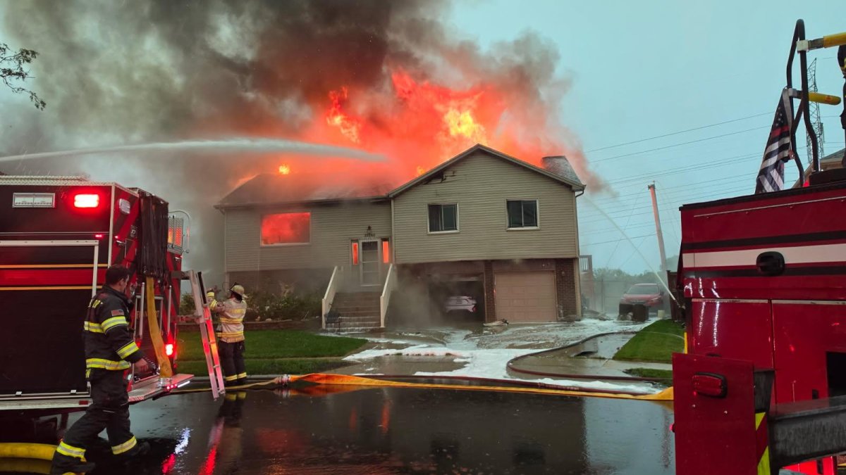 Fallen power line causes suburban house to erupt in flames during intense storms Fallen power line causes suburban house to erupt in flames during intense storms