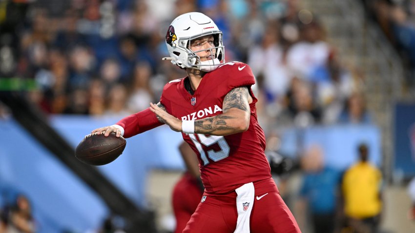 Carson Beck #19 of the Arizona Cardinals throws a pass.