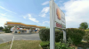 Man charged after being shot in alleged armed robbery at suburban gas station
