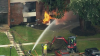 Flames burst through suburban apartment building roof during gas meter installation