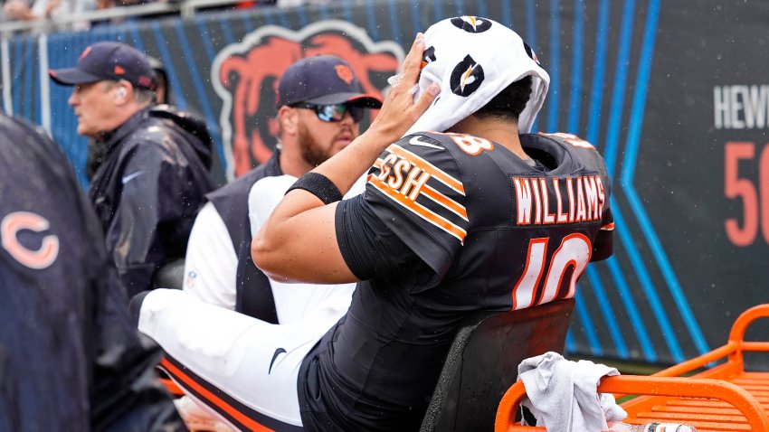 Caleb Williams of the Chicago Bears is carted off the field