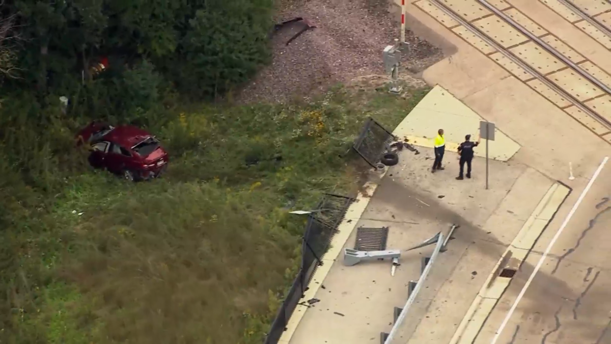 1 hospitalized after crash with Metra train sends car into wooded ditch