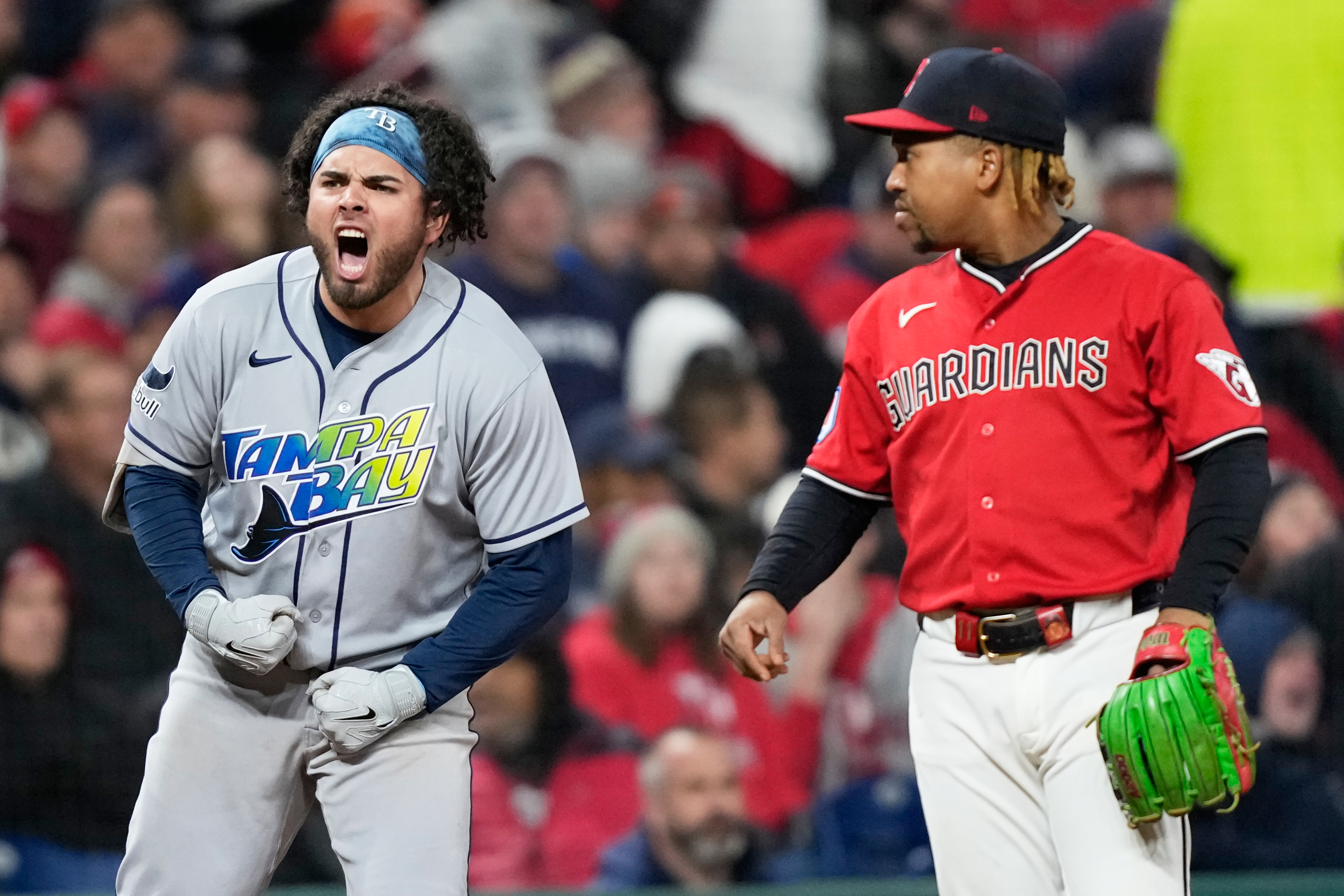 Tampa Bay Rays’ Jonathan Aranda celebrates after RBI-single as Cleveland Guardians third baseman José Ramírez looks on during the seventh inning in Game 4 of an American League Championship Series baseball game in Cleveland, Saturday, Oct. 17, 2026.