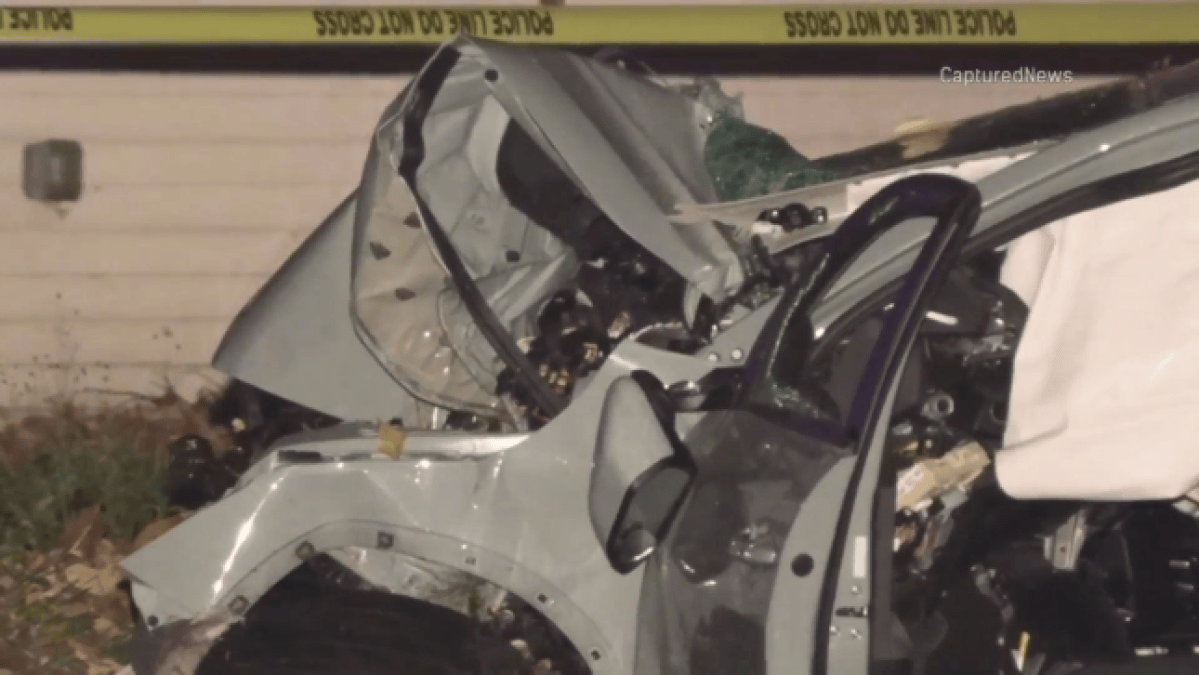 Car crashes in suburban Rolling meadows neighborhood, with debris strewn across the road